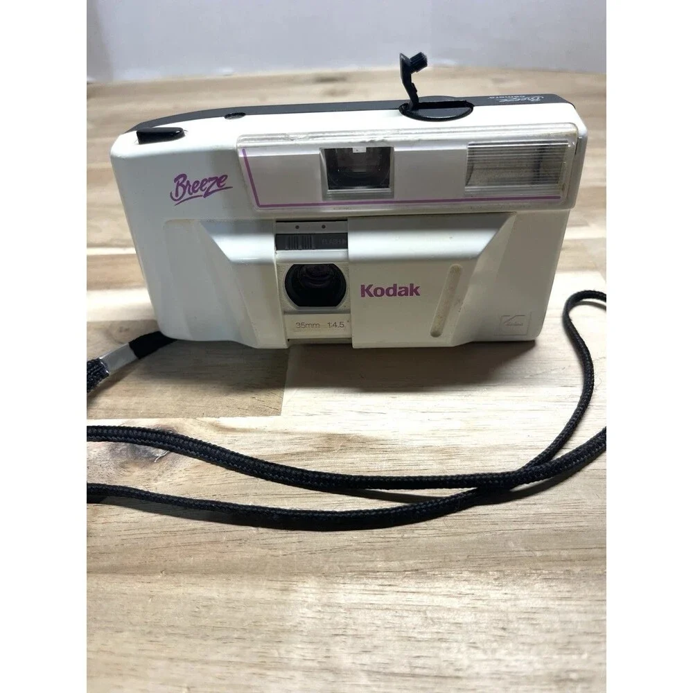Kodak White Breeze Point-and-Shoot Camera with Black Strap and Pink Accents